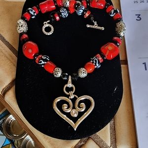 Hand designed coral necklace and earring set made by Rena.